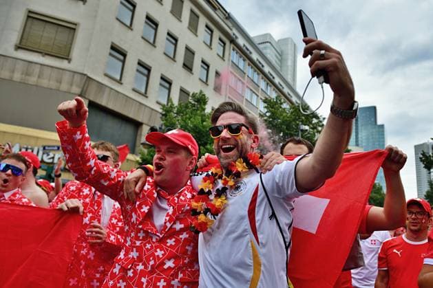 23 6 2024 Soccer fans Fans of the Swiss national team on their way through the Frankfurt train station district to the stadium to watch the match against Germany Frankfurt am Main Kaiserstrasse Hessen Germany 0625284077st