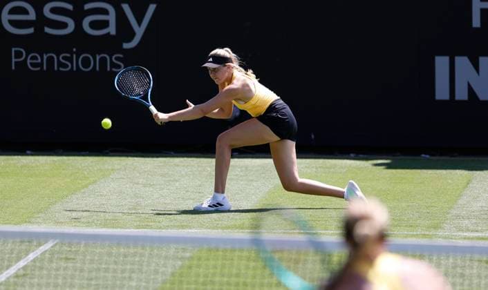 23rd June 2024; Devonshire Park, Eastbourne, East Sussex, England: Rothesay International Eastbourne, Qualifying Day 2, Ella McDonald (GBR) plays a backhand against Ashlyn Krueger (USA) in the Qualification Final  ActionPlus12659389 HongboxChen