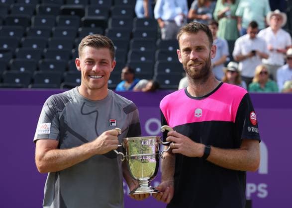 23rd June 2024; Cinch Championships, Queens Club, West Kensington, London, England: Cinch Championships Queens Club, Day 7; Neal Skupski (GBR) and doubles partner Michael Venus (NZL) pose with the mens doubles trophy after defeating Taylor Fritz (USA) and Karen Khachanov (RUS)  ActionPlus12659428 JohnxPatrickxFletcher
