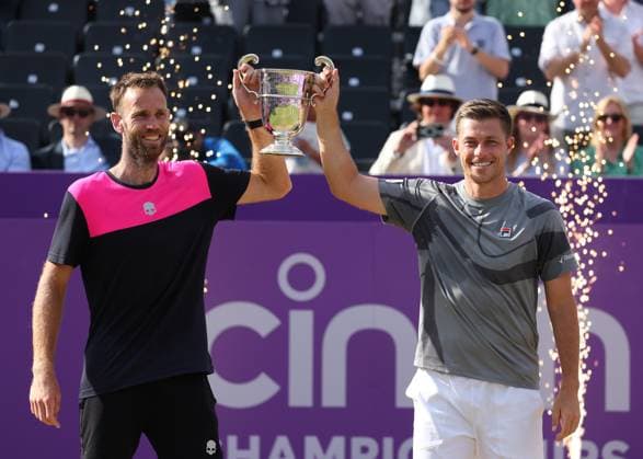 23rd June 2024; Cinch Championships, Queens Club, West Kensington, London, England: Cinch Championships Queens Club, Day 7; Neal Skupski (GBR) and doubles partner Michael Venus (NZL) pose with the mens doubles trophy after defeating Taylor Fritz (USA) and Karen Khachanov (RUS)  ActionPlus12659430 JohnxPatrickxFletcher