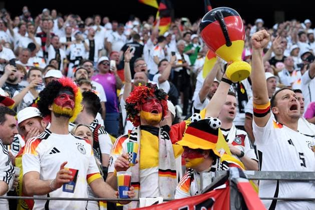 Soccer UEFA EURO 2024 group stage 3 match day Switzerland Germany on 23 06 2024 in the Frankfurt Arena in Frankfurt Make-up fan spectator Germany with wig in the colors black red gold and European Championship trophy trophy Henri Delaunay trophy xRx
