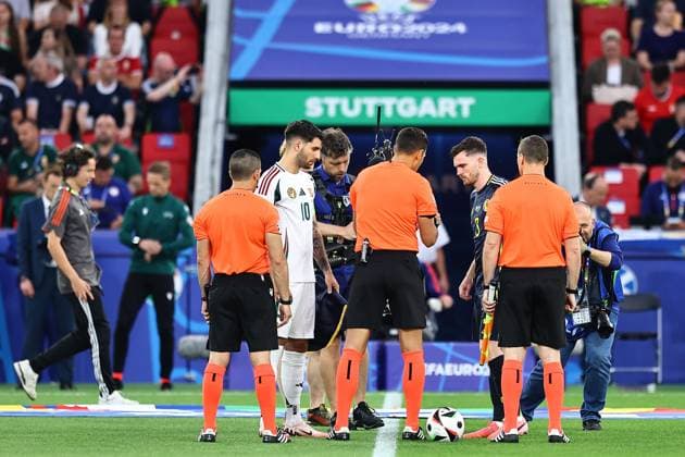 Dominik Szoboszlai of Hungary and Andrew Robertson of Scotland do the coin toss with officials prior to the match Scotland v Hungary, UEFA European Championship, EM, Europameisterschaft 2024, Group A, Football, Stuttgart Arena, Stuttgart, Germany, 23 Jun 2024 EDITORIAL USE ONLY No use with unauthorised audio, video, data, fixture lists, club league logos or live services. Online in-match use limited to 120 images, no video emulation. No use in betting, games or single club league player publications.  Copyright: xMichaelxZemanek Shutterstockx 14548075o