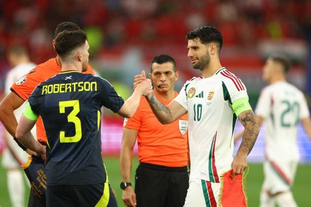 Andrew Robertson of Scotland and Dominik Szoboszlai of Hungary shake hands prior to the match Scotland v Hungary, UEFA European Championship, EM, Europameisterschaft 2024, Group A, Football, Stuttgart Arena, Stuttgart, Germany, 23 Jun 2024 EDITORIAL USE ONLY No use with unauthorised audio, video, data, fixture lists, club league logos or live services. Online in-match use limited to 120 images, no video emulation. No use in betting, games or single club league player publications. Copyright: xKieranxMcManus Shutterstockx 14548072af