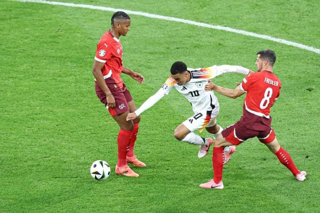 Jamal Musiala of Germany in action with Remo Freuler of Switzerland Switzerland v Germany, UEFA European Championship, EM, Europameisterschaft 2024, Group A, Football, Frankfurt Arena, Frankfurt am Main, Germany, 23 Jun 2024 EDITORIAL USE ONLY No use with unauthorised audio, video, data, fixture lists, club league logos or live services. Online in-match use limited to 120 images, no video emulation. No use in betting, games or single club league player publications. Copyright: xMattxWest Shutterstockx 14548071aq