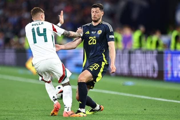 Bendeguz Bolla of Hungary and Scott McKenna of Scotland Scotland v Hungary, UEFA European Championship, EM, Europameisterschaft 2024, Group A, Football, Stuttgart Arena, Stuttgart, Germany, 23 Jun 2024 EDITORIAL USE ONLY No use with unauthorised audio, video, data, fixture lists, club league logos or live services. Online in-match use limited to 120 images, no video emulation. No use in betting, games or single club league player publications.  Copyright: xMichaelxZemanek Shutterstockx 14548075u