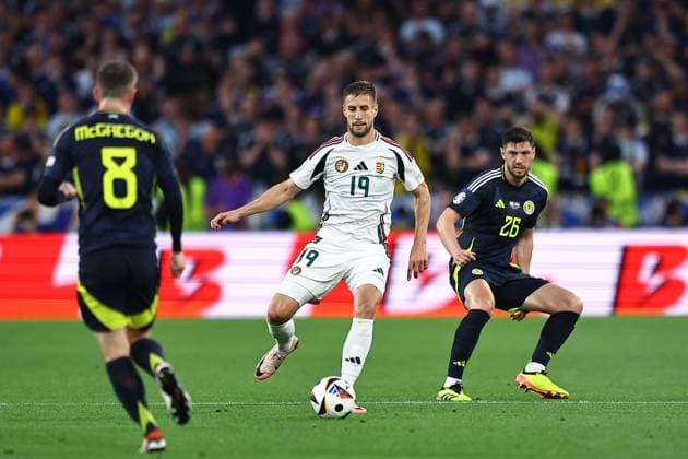 Barnabas Varga of Hungary and Scott McKenna of Scotland Scotland v Hungary, UEFA European Championship, EM, Europameisterschaft 2024, Group A, Football, Stuttgart Arena, Stuttgart, Germany, 23 Jun 2024 EDITORIAL USE ONLY No use with unauthorised audio, video, data, fixture lists, club league logos or live services. Online in-match use limited to 120 images, no video emulation. No use in betting, games or single club league player publications.  Copyright: xMichaelxZemanek Shutterstockx 14548075x