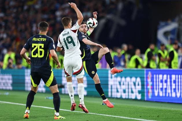 Andrew Robertson of Scotland and Barnabas Varga of Hungary Scotland v Hungary, UEFA European Championship, EM, Europameisterschaft 2024, Group A, Football, Stuttgart Arena, Stuttgart, Germany, 23 Jun 2024 EDITORIAL USE ONLY No use with unauthorised audio, video, data, fixture lists, club league logos or live services. Online in-match use limited to 120 images, no video emulation. No use in betting, games or single club league player publications.  Copyright: xMichaelxZemanek Shutterstockx 14548075w