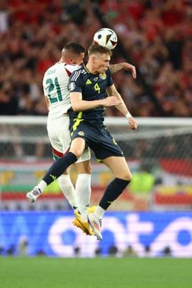 Scott McTominay of Scotland and Endre Botka of Hungary Scotland v Hungary, UEFA European Championship, EM, Europameisterschaft 2024, Group A, Football, Stuttgart Arena, Stuttgart, Germany, 23 Jun 2024 EDITORIAL USE ONLY No use with unauthorised audio, video, data, fixture lists, club league logos or live services. Online in-match use limited to 120 images, no video emulation. No use in betting, games or single club league player publications.  Copyright: xKieranxMcManus Shutterstockx 14548072al