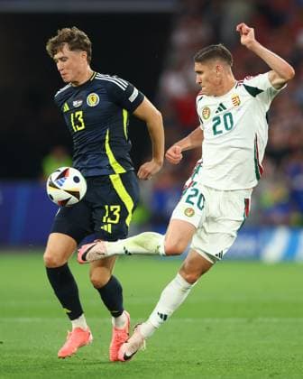 Jack Hendry of Scotland and Roland Sallai of Hungary Scotland v Hungary, UEFA European Championship, EM, Europameisterschaft 2024, Group A, Football, Stuttgart Arena, Stuttgart, Germany, 23 Jun 2024 EDITORIAL USE ONLY No use with unauthorised audio, video, data, fixture lists, club league logos or live services. Online in-match use limited to 120 images, no video emulation. No use in betting, games or single club league player publications.  Copyright: xKieranxMcManus Shutterstockx 14548072am