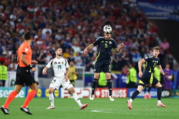Grant Hanley of Scotland wins a header Scotland v Hungary, UEFA European Championship, EM, Europameisterschaft 2024, Group A, Football, Stuttgart Arena, Stuttgart, Germany, 23 Jun 2024 EDITORIAL USE ONLY No use with unauthorised audio, video, data, fixture lists, club league logos or live services. Online in-match use limited to 120 images, no video emulation. No use in betting, games or single club league player publications.  Copyright: xMichaelxZemanek Shutterstockx 14548075ac