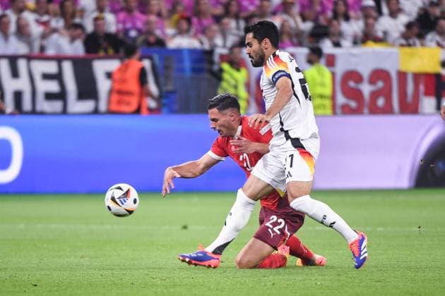 FRANKFURT AM MAIN, GERMANY JUNE 23 Ilkay Gundogan of Germany R against Fabian Schar of Switzerland L during the UEFA EURO 2024 group stage match between Switzerland and Germany at Frankfurt Arena on June 23, 2024 in Frankfurt am Main, Germany Frankfurt am Main Frankfurt Arena Hesse Germany Copyright: xJustPictures.ch ManuelxWinterbergerx jp-en-EuSpIm-JP4_MAN_Scotland_Swiss_19Jun2024_CO_00056