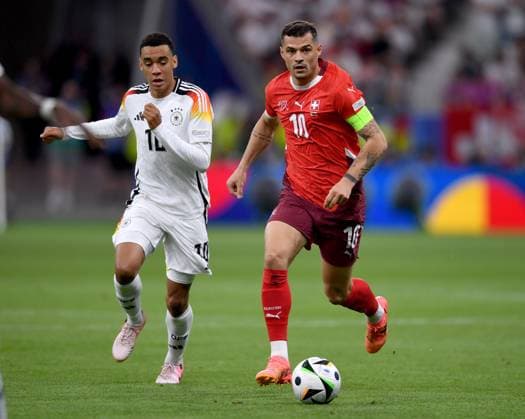 Football Euro 2024 Group A 23 06 2024 Switzerland Germany Jamal Musiala left, Germany v Granit Xhaka right, Switzerland