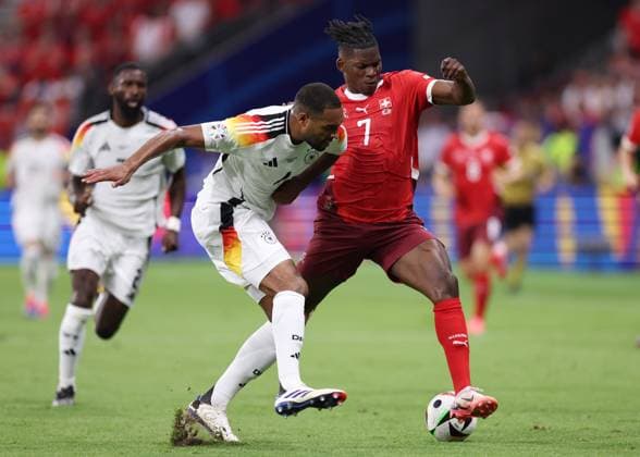 Frankfurt, Germany, 23rd June 2024. Jonathan Tah of Germany tussles with Breel Embolo of Switzerland during the UEFA European Championships match at Commerzbank-Arena, Frankfurt. Picture credit should read: David Klein Sportimage EDITORIAL USE ONLY. No use with unauthorised audio, video, data, fixture lists, club league logos or live services. Online in-match use limited to 120 images, no video emulation. No use in betting, games or single club league player publications. SPI-3203-0074