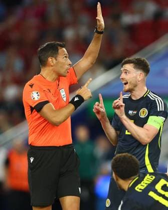 Andrew Robertson of Scotland talks with referee Facundo Tello Scotland v Hungary, UEFA European Championship, EM, Europameisterschaft 2024, Group A, Football, Stuttgart Arena, Stuttgart, Germany, 23 Jun 2024 EDITORIAL USE ONLY No use with unauthorised audio, video, data, fixture lists, club league logos or live services. Online in-match use limited to 120 images, no video emulation. No use in betting, games or single club league player publications.  Copyright: xKieranxMcManus Shutterstockx 14548072au
