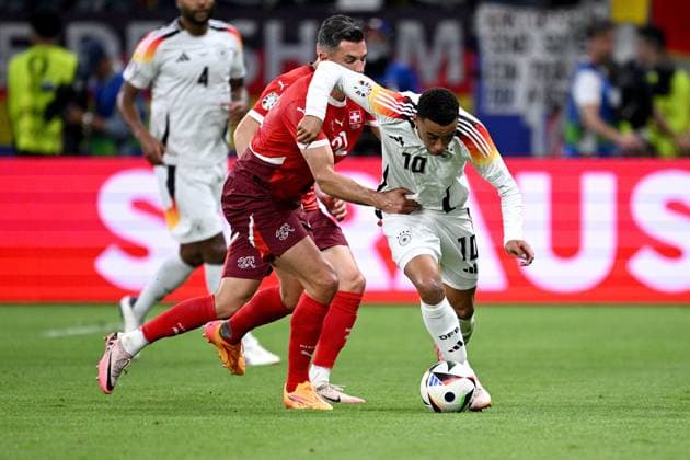 Football Euro 2024 Group A 23 06 2024 Switzerland Germany Fabian Schaer left, Switzerland v Jamal Musiala right, Germany