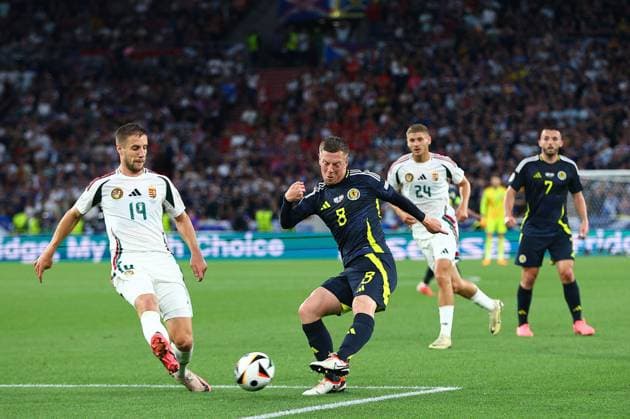 Callum McGregor of Scotland and Bendeguz Bolla of Hungary Scotland v Hungary, UEFA European Championship, EM, Europameisterschaft 2024, Group A, Football, Stuttgart Arena, Stuttgart, Germany, 23 Jun 2024 EDITORIAL USE ONLY No use with unauthorised audio, video, data, fixture lists, club league logos or live services. Online in-match use limited to 120 images, no video emulation. No use in betting, games or single club league player publications. Copyright: xMichaelxZemanek Shutterstockx 14548075at