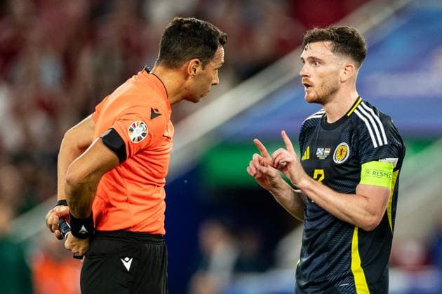 UEFA EURO 2024 Scotland Hungary 23 06 2024 Andrew Robertson Scotland, 3 , Facundo Tello Argentina, Referee UEFA EURO 2024 Scotland Hungary Stuttgart Stadium, Stuttgart 23 06 2024 Copyright: xBEAUTIFULxSPORTS Buriakovx