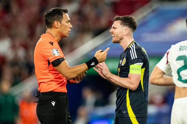 UEFA EURO 2024 Scotland Hungary 23 06 2024 Andrew Robertson Scotland, 3 , Facundo Tello Argentina, Referee UEFA EURO 2024 Scotland Hungary Stuttgart Stadium, Stuttgart 23 06 2024 Copyright: xBEAUTIFULxSPORTS Buriakovx