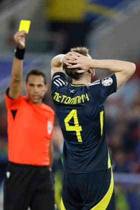 Scotland v Hungary: Group A - UEFA EURO, EM, Europameisterschaft,Fussball 2024 Referee Facundo Tello shows Yellow card to Scott McTominay during the UEFA EURO 2024 group stage match between Scotland and Hungary at Stuttgart Arena on June 23, 2024 in Stuttgart, Germany. Stuttgart Stuttgart Arena Germany Germany Copyright: xRichardxSellers Sportsphoto APLx 14042349