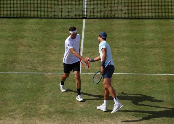 23rd June 2024; Cinch Championships, Queens Club, West Kensington, London, England: Cinch Championships Queens Club, Day 7; Taylor Fritz (USA) with Karen Khachanov (RUS) during their doubles final against Neal Skupski (GBR) &amp; Michael Venus (NZL)  ActionPlus12659576 JohnxPatrickxFletcher