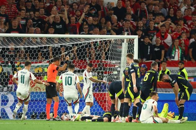 Barnabas Varga of Hungary goes to ground injured Scotland v Hungary, UEFA European Championship, EM, Europameisterschaft 2024, Group A, Football, Stuttgart Arena, Stuttgart, Germany, 23 Jun 2024 EDITORIAL USE ONLY No use with unauthorised audio, video, data, fixture lists, club league logos or live services. Online in-match use limited to 120 images, no video emulation. No use in betting, games or single club league player publications. Copyright: xKieranxMcManus Shutterstockx 14548072bg