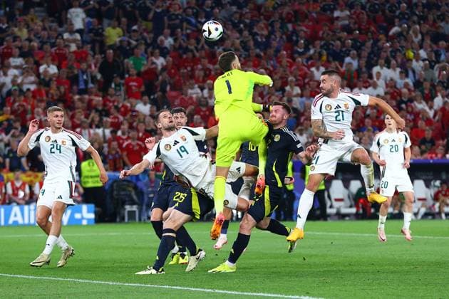 Angus Gunn of Scotland comes for the ball and Barnabas Varga of Hungary is injured in the process Scotland v Hungary, UEFA European Championship, EM, Europameisterschaft 2024, Group A, Football, Stuttgart Arena, Stuttgart, Germany, 23 Jun 2024 EDITORIAL USE ONLY No use with unauthorised audio, video, data, fixture lists, club league logos or live services. Online in-match use limited to 120 images, no video emulation. No use in betting, games or single club league player publications. Copyright: xMichaelxZemanek Shutterstockx 14548075ax