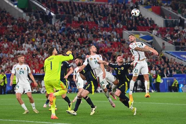 Collision Barnabas VARGA HUN with Anthony RALSTON Scotland , penalty area scene Fainting,K O Group Stage Group A Scotland SCO Hungary HUN on 23 06 2024, Stuttgart Arena Football UEFA EURO 2024 GERMANY from 14 06 2024 14 07 2024 Â