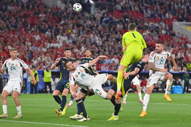 Collision Barnabas VARGA HUN with Anthony RALSTON Scotland , penalty area scene Fainting,K O Group Stage Group A Scotland SCO Hungary HUN on 23 06 2024, Stuttgart Arena Football UEFA EURO 2024 GERMANY from 14 06 2024 14 07 2024 Â