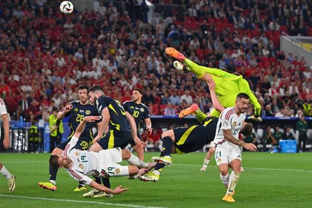 Collision Barnabas VARGA HUN with Anthony RALSTON Scotland , penalty area scene Fainting,K O Group Stage Group A Scotland SCO Hungary HUN on 23 06 2024, Stuttgart Arena Football UEFA EURO 2024 GERMANY from 14 06 2024 14 07 2024 Â