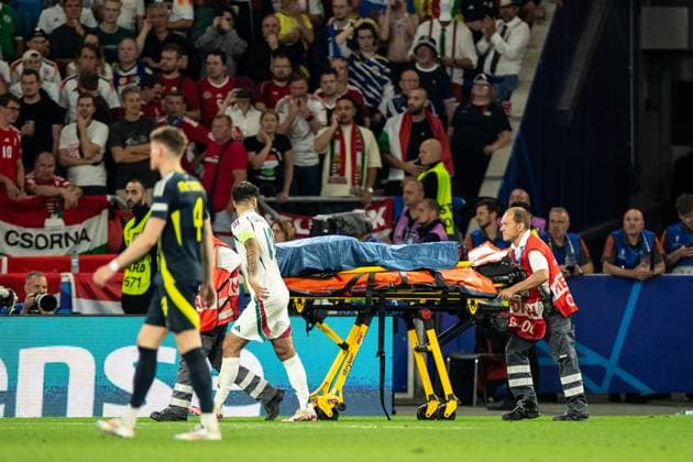 UEFA EURO 2024 Scotland Hungary 23 06 2024 one player of Hungary was injured, rescue service and stewards on the pitch UEFA EURO 2024 Scotland Hungary Stuttgart Stadium, Stuttgart 23 06 2024 Copyright: xBEAUTIFULxSPORTS Buriakovx