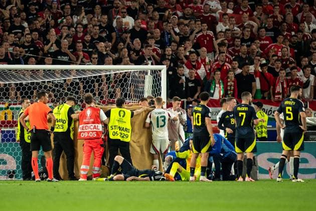 UEFA EURO 2024 Scotland Hungary 23 06 2024 one player of Hungary was injured, rescue service and stewards on the pitch UEFA EURO 2024 Scotland Hungary Stuttgart Stadium, Stuttgart 23 06 2024 Copyright: xBEAUTIFULxSPORTS Buriakovx
