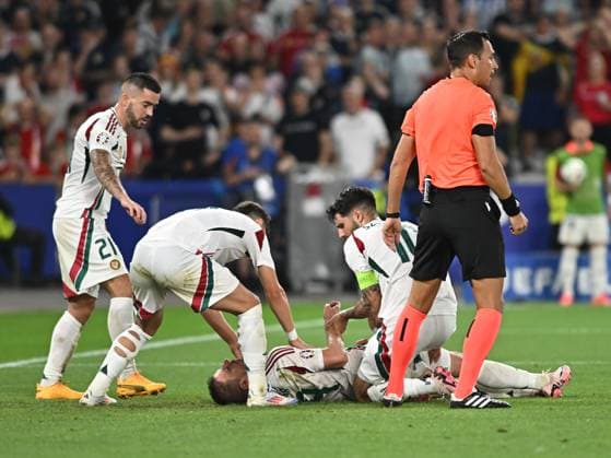Barnabas Varga on the ground after an injury while Endre Botka, Milos Kerkez and Dominik Szoboszlai look on during the UEFA EURO 2024 football match between Scotland and Hungary at the Stuttgart Arena in Stuttgart, Sunday 23 June 2024 Cologne Copyright: xRazvanxPasarica SPORTxPICTURESx