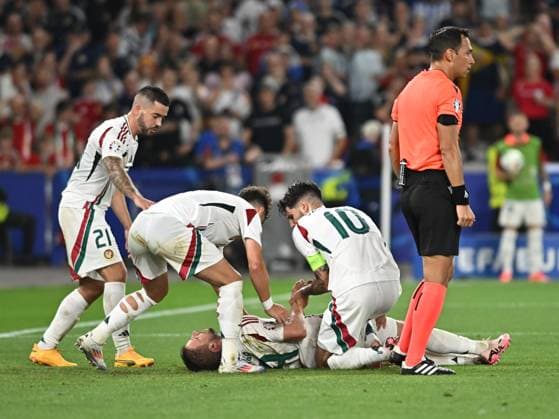 Barnabas Varga on the ground after an injury while Endre Botka, Milos Kerkez and Dominik Szoboszlai look on during the UEFA EURO 2024 football match between Scotland and Hungary at the Stuttgart Arena in Stuttgart, Sunday 23 June 2024 Cologne Copyright: xRazvanxPasarica SPORTxPICTURESx