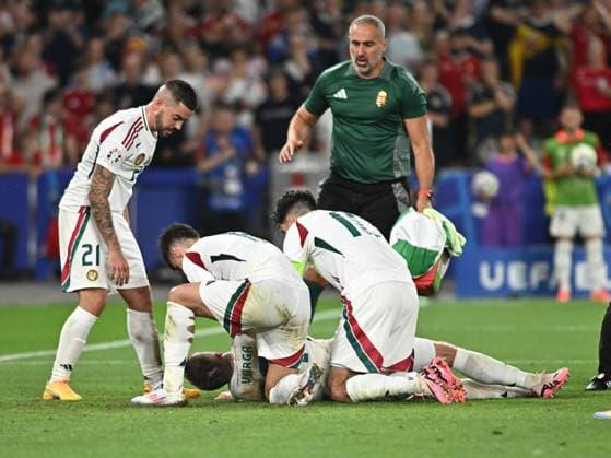 Barnabas Varga on the ground after an injury while Endre Botka, Milos Kerkez and Dominik Szoboszlai look on during the UEFA EURO 2024 football match between Scotland and Hungary at the Stuttgart Arena in Stuttgart, Sunday 23 June 2024 Cologne Copyright: xRazvanxPasarica SPORTxPICTURESx