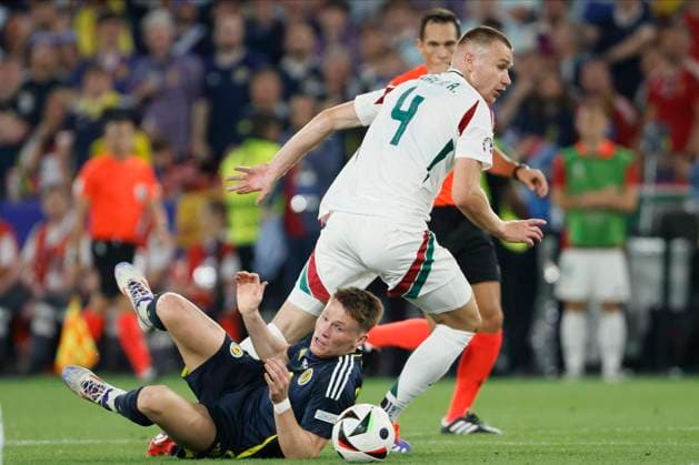 Scotland v Hungary: Group A - UEFA EURO, EM, Europameisterschaft,Fussball 2024 Scott McTominay of Scotland and Attila Szalai of Hungary challenge during the UEFA EURO 2024 group stage match between Scotland and Hungary at Stuttgart Arena on June 23, 2024 in Stuttgart, Germany. Stuttgart Stuttgart Arena Germany Germany Copyright: xRichardxSellers Sportsphoto APLx 14042366