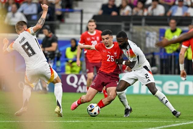 240623 EURO2024 SWITZERLAND VS GERMANY Toni Kroos (8) of Germany and Antonio Rudiger (2) of Germany defending on Zeki Amdouni (25) of Switzerland during a soccer game between the national teams of Switzerland and Germany on the third matchday in Group A in the group stage of the UEFA EURO, EM, Europameisterschaft,Fussball 2024 tournament , on Sunday 23 June 2024 in Frankfurt , Germany . PHOTO SPORTPIX David Catry FRANKFURT GERMANY  Copyright: xx 467996