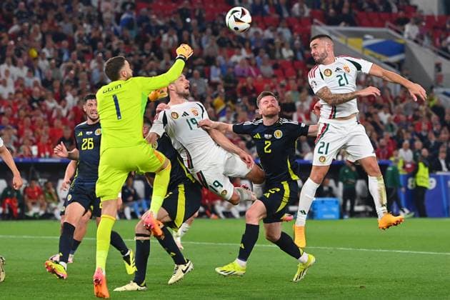 Collision Barnabas VARGA 19,HUN with goalkeeper Angus GUNN Scotland , penalty area scene Fainting,K O action,tackle re Endre BOTKA HUN , Anthony RALSTON Scotland , group stage group A Scotland SCO Hungary HUN 0 1, on 23 06 2024, Stuttgart Arena Football UEFA EURO 2024 GERMANY from 14 06 2024 14 07 2024