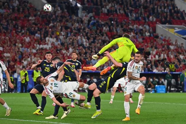 Collision Barnabas VARGA 19,HUN with goalkeeper Angus GUNN Scotland , penalty area scene Fainting,K O action,tackle re Endre BOTKA HUN , Anthony RALSTON Scotland , group stage group A Scotland SCO Hungary HUN 0 1, on 23 06 2024, Stuttgart Arena Football UEFA EURO 2024 GERMANY from 14 06 2024 14 07 2024