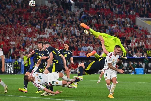 Collision Barnabas VARGA 19,HUN with goalkeeper Angus GUNN Scotland , penalty area scene Fainting,K O action,tackle re Endre BOTKA HUN , Anthony RALSTON Scotland , group stage group A Scotland SCO Hungary HUN 0 1, on 23 06 2024, Stuttgart Arena Football UEFA EURO 2024 GERMANY from 14 06 2024 14 07 2024