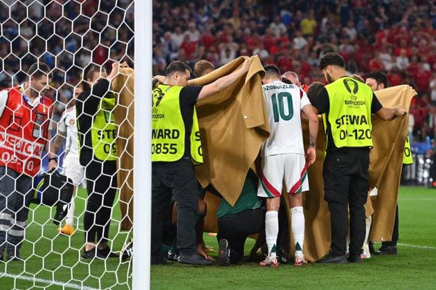After a violent collision between Barnabas VARGA HUN and goalkeeper Angus GUNN Scotland, stewards hold blankets as a screen during emergency assistance, emergency doctor, Group stage Group A Scotland SCO Hungary HUN 0 1 on 23 06 2024, Stuttgart Arena Football UEFA EURO 2024 GERMANY from 14 06 2024 14 07 2024