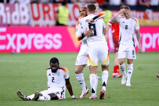 FUELLKRUG Niclas Team Germany cheers after the final whistle with SANE Leroy on the ground RUEDIGER Antonio UEFA Football EURO 2024 in Germany Preliminary Round Match Group A Switzerland Germany 1 1 on 23 06 2024 in Frankfurt DFL REGULATIONS PROHIBIT ANY USE OF PHOTOGRAPHS as IMAGE SEQUENCES and or QUASI VIDEO Copyright: xLacixPerenyix