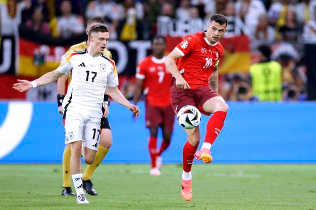 XHAKA Granit Kapitaen Team Schweiz with WIRTZ Florian UEFA Fussball EURO 2024 in Deutschland Vorrundenspiel Gruppe A Schweiz Deutschland 1 1 am 23 06 2024 in Frankfurt DFL REGULATIONS PROHIBIT ANY USE OF PHOTOGRAPHS as IMAGE SEQUENCES and or QUASI VIDEO Copyright: xLacixPerenyix
