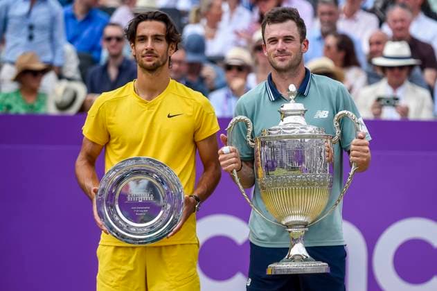 (240624) -- LONDON, June 24, 2024 -- Tommy Paul (R) of the United States and Lorenzo Musetti of Italy pose for photos at the awarding ceremony after the men s singles final match between Tommy Paul of the United States and Lorenzo Musetti of Italy at the Cinch ATP, Tennis Herren Championships at The Queen s Club in London, Britain, June 23, 2024. (Photo by Xinhua) (SP)BRITAIN-LONDON-TENNIS-QUEEN S CLUB-MEN S SINGLES-FINAL StephenxChung 