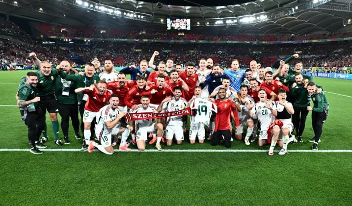 STUTTGART, GERMANY - JUNE 23: Dominik Szoboszlai, Zsolt Nagy and players and staff of Hungary celebrate after wining the match, with Barnabas Varga shirt during the UEFA EURO, EM, Europameisterschaft,Fussball 2024 group stage match between Scotland and Hungary at Stuttgart Arena on June 23, 2024 in Stuttgart, Germany. Photo by Sebastian Frej Scotland v Hungary: Group A - UEFA EURO 2024 Copyright: xSebastianxFrejx