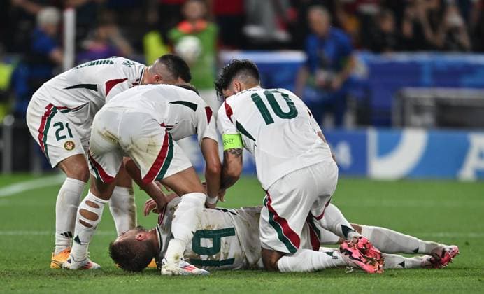 STUTTGART, GERMANY - JUNE 23: Barnabas Varga of Hungary lies on the ground and is assisted by teammates after a collision with goalkeeper Angus Gunn of Scotland during the UEFA EURO, EM, Europameisterschaft,Fussball 2024 group stage match between Scotland and Hungary at Stuttgart Arena on June 23, 2024 in Stuttgart, Germany. Photo by Sebastian Frej Scotland v Hungary: Group A - UEFA EURO 2024 Copyright: xSebastianxFrejx