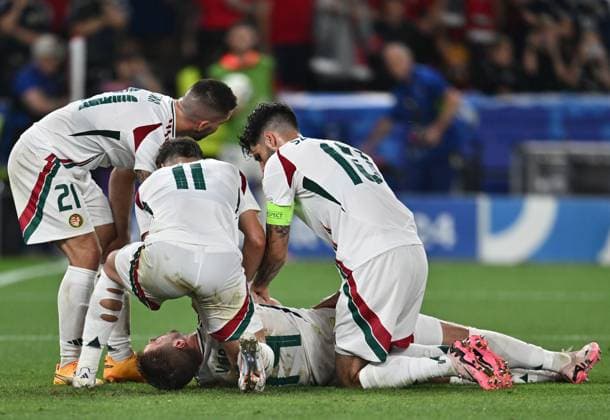STUTTGART, GERMANY - JUNE 23: Barnabas Varga of Hungary lies on the ground and is assisted by teammates after a collision with goalkeeper Angus Gunn of Scotland during the UEFA EURO, EM, Europameisterschaft,Fussball 2024 group stage match between Scotland and Hungary at Stuttgart Arena on June 23, 2024 in Stuttgart, Germany. Photo by Sebastian Frej Scotland v Hungary: Group A - UEFA EURO 2024 Copyright: xSebastianxFrejx