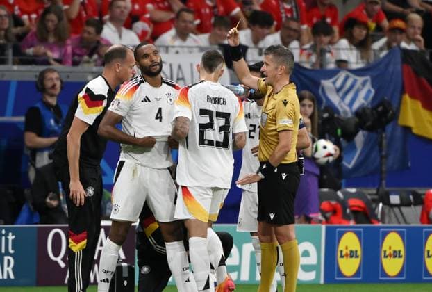 Jonathan Tah Germany , left , is shown a yellow card by referee Daniele Orsato 23 06 2024, European Football Championship 2024, Preliminary round, Matchday 3 Switzerland Germany 1 1 Frankfurt Frankfurt Arena Hessen Germany Team2
