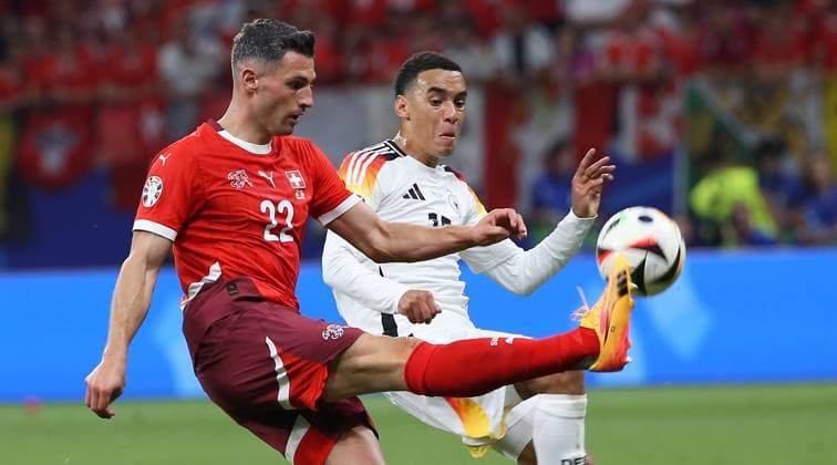 BAU 23 06 2024 Frankfurt Soccer EM 2024 Switzerland vs Germany, f l Fabian Schär SUI , Jamal Musiala GER