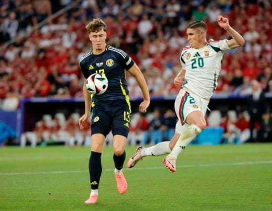 23 06 2024, European Football Championship, Scotland vs Hungary,MHP Stuttgart, Sport, in the picture Jack Hendry Scotland vs Roland Sallai Hungary