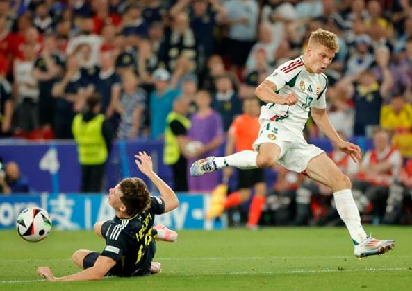23 06 2024, European Football Championship, Scotland vs Hungary,MHP Stuttgart, Sport, in the picture Jack Hendry Scotland vs Andras Schaefer Hungary